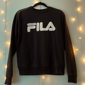 It’s a black sweatshirt from FILA